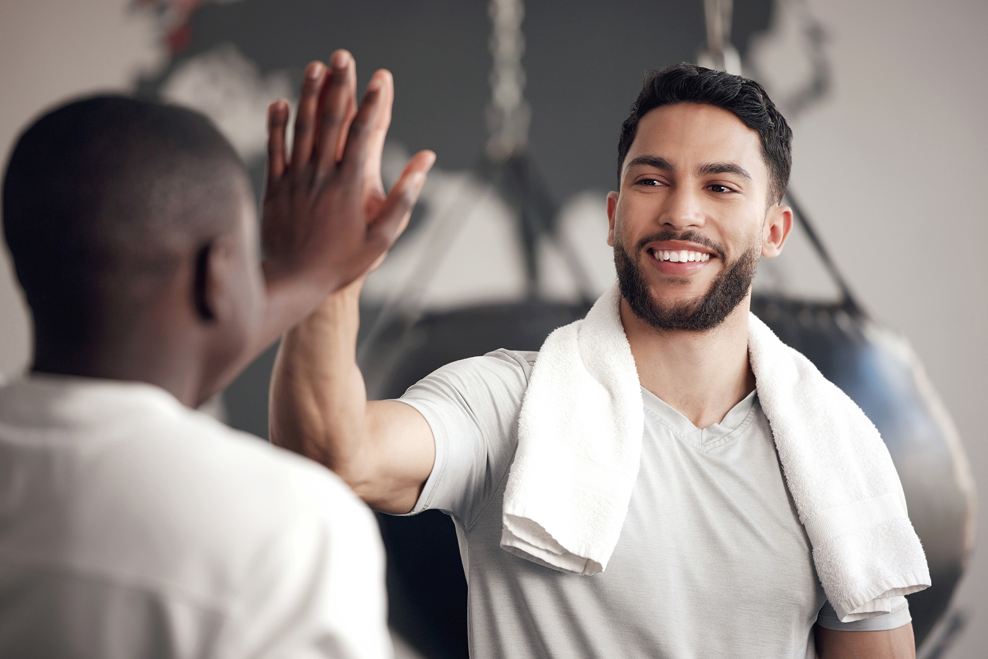 Two men exercising at fitness center at Mason